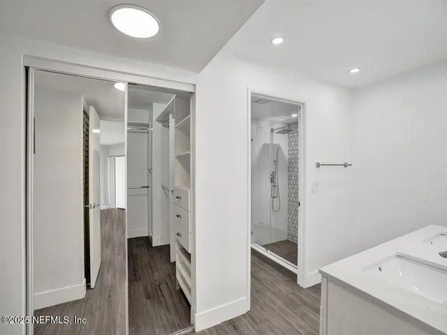 a bathroom with a shower and a sink