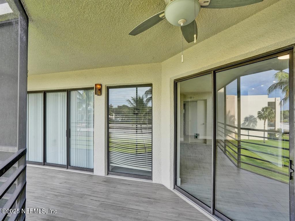 5851 Camino Del Sol, Unit 305 Boca Raton, FL 33433 - Photo 37 of 47 workspace with wooden floor and windows