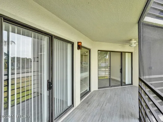 a view of hallway with windows
