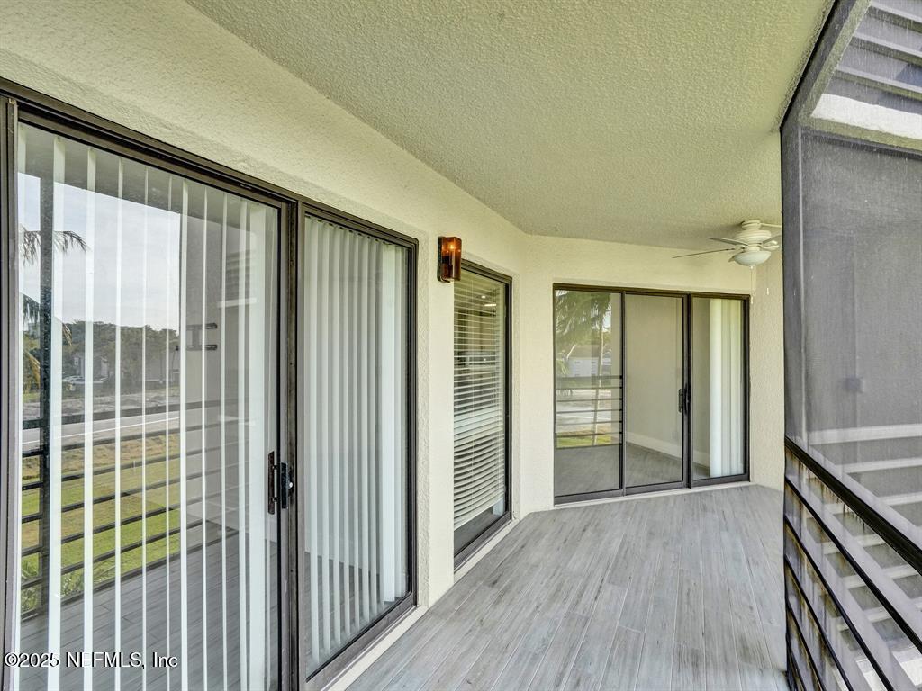5851 Camino Del Sol, Unit 305 Boca Raton, FL 33433 - Photo 39 of 47 a view of hallway with windows