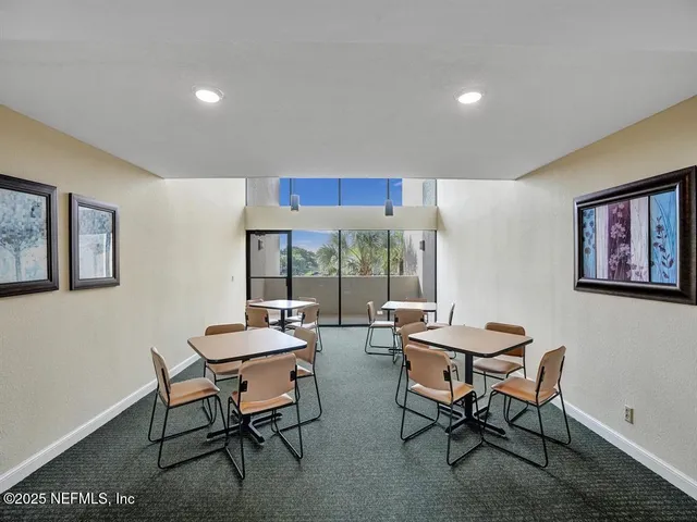 a room with furniture and a large window