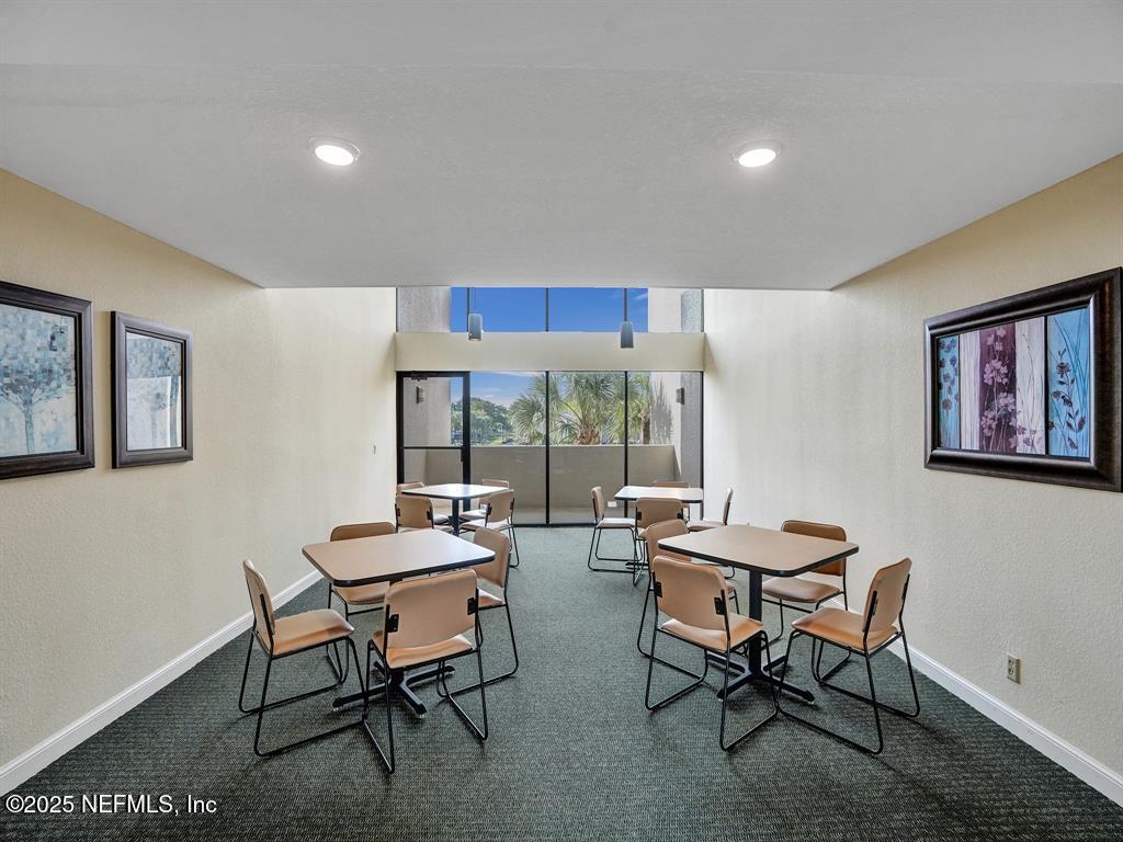 5851 Camino Del Sol, Unit 305 Boca Raton, FL 33433 - Photo 41 of 47 a room with furniture and a large window