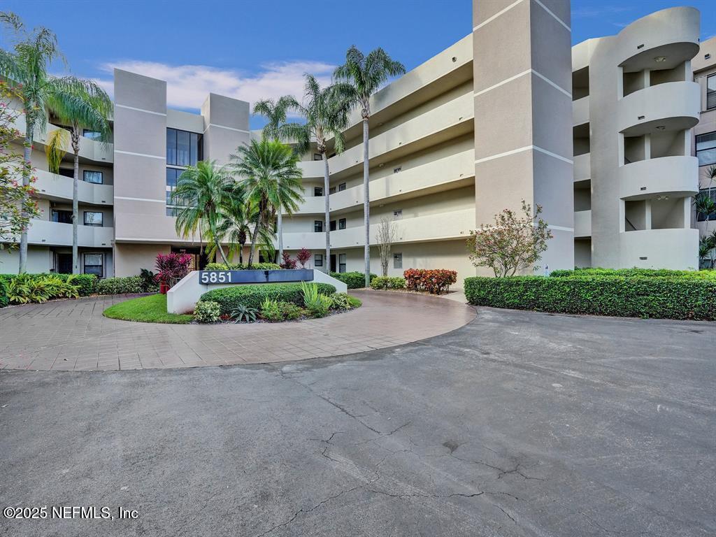 5851 Camino Del Sol, Unit 305 Boca Raton, FL 33433 - Photo 45 of 47 a view of tall building with a street