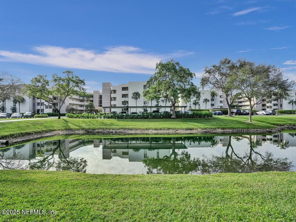 5851 Camino Del Sol, Unit 305 Boca Raton, FL 33433 - Photo 46 of 47 a garden view with a fountain