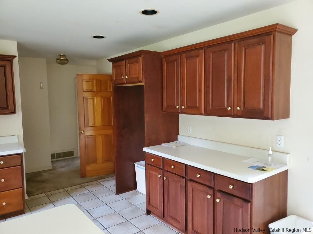 144 Burnt Meadows Road Gardiner, NY 12525 - Photo 16 of 31 a kitchen with stainless steel appliances a refrigerator and cabinets