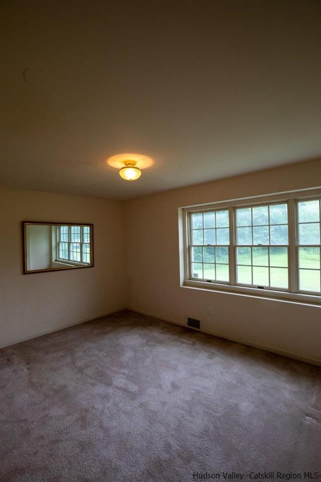 144 Burnt Meadows Road Gardiner, NY 12525 - Photo 26 of 31 an empty room with a window