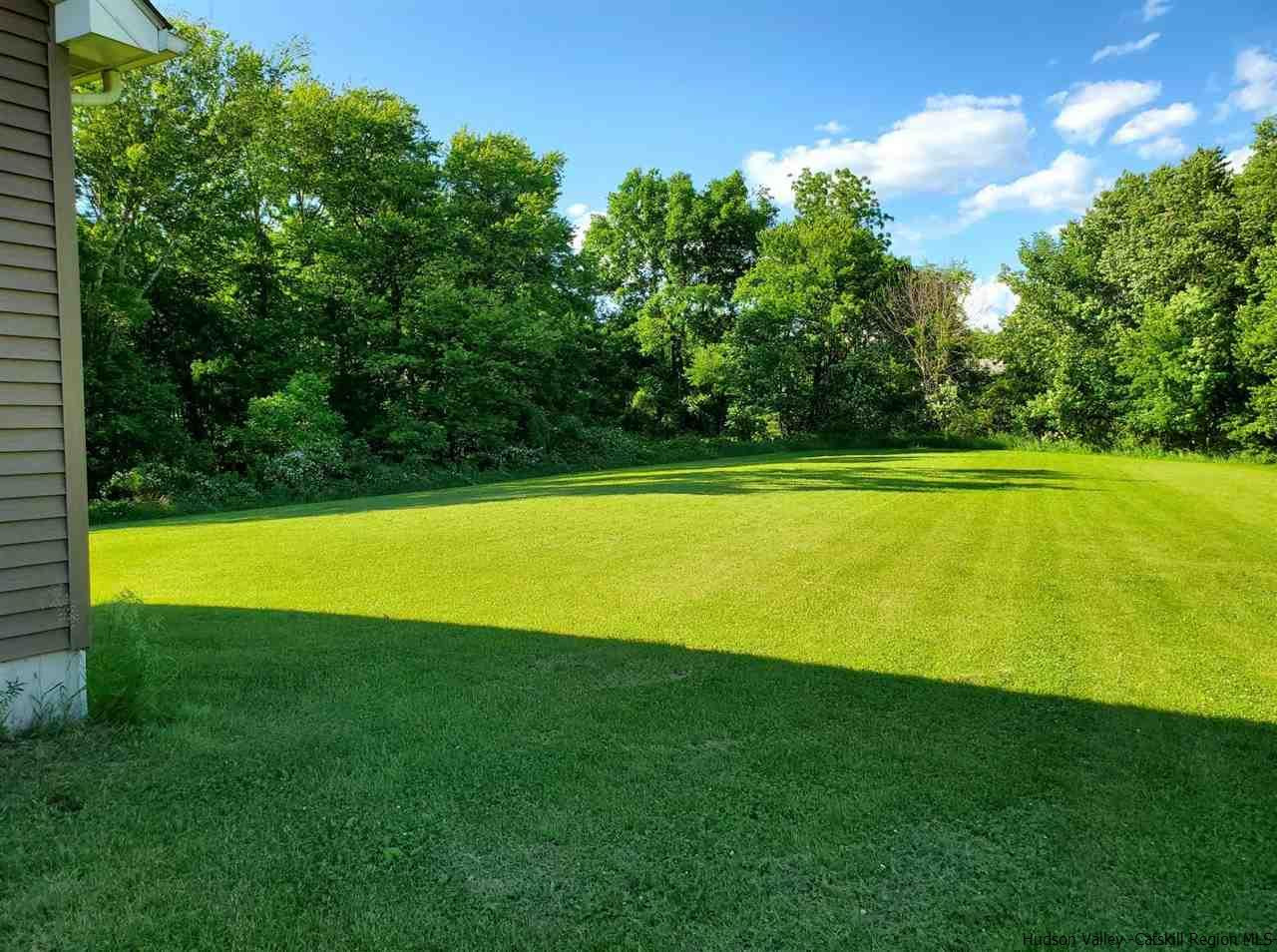 144 Burnt Meadows Road Gardiner, NY 12525 - Photo 9 of 31 a view of a swimming pool with an outdoor space and seating area