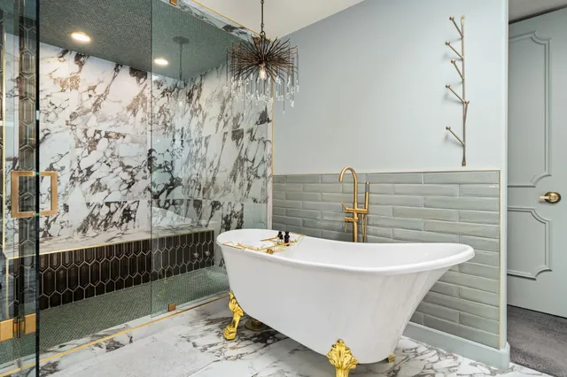 a bathroom with a bathtub and shower