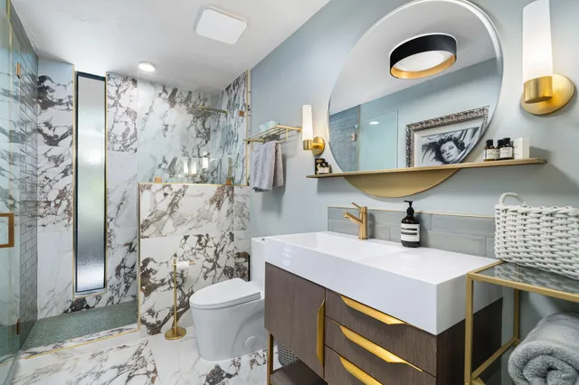 a bathroom with a sink a toilet and shower curtain