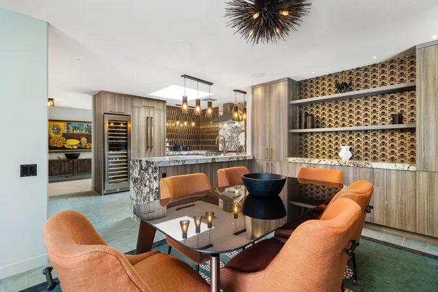 a view of a swimming pool with outdoor seating