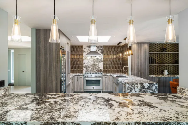 a kitchen with a refrigerator and a sink