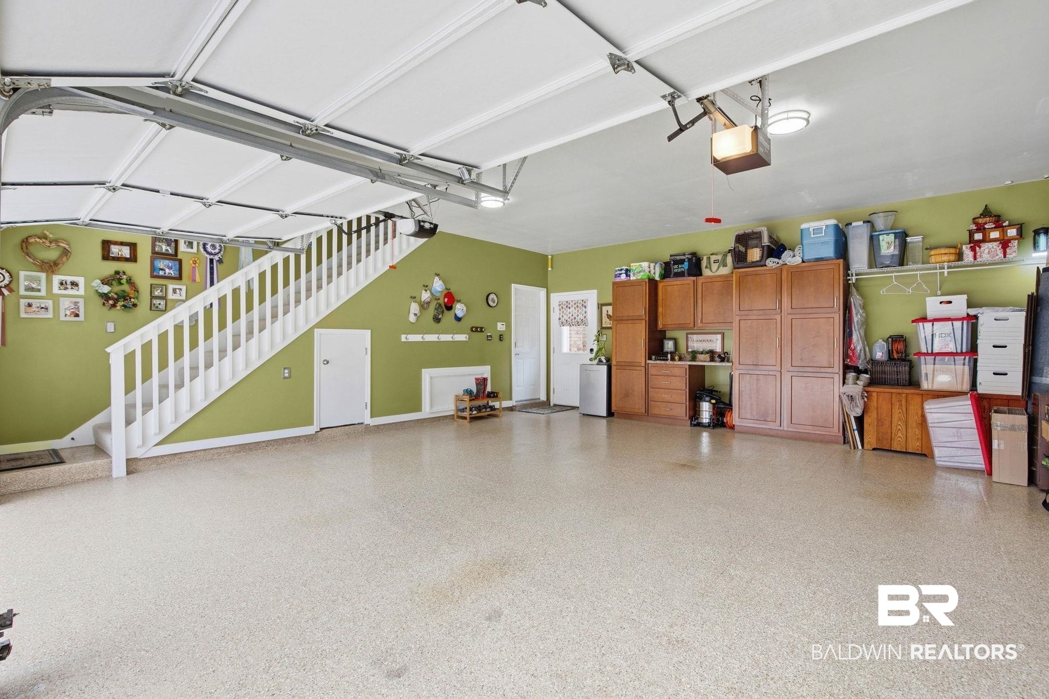 31515 Rhett Drive Spanish Fort, AL 36527 - Photo 65 of 100 Custom cabinets and epoxy floor. The garage fridge and EV port conveys with the home.