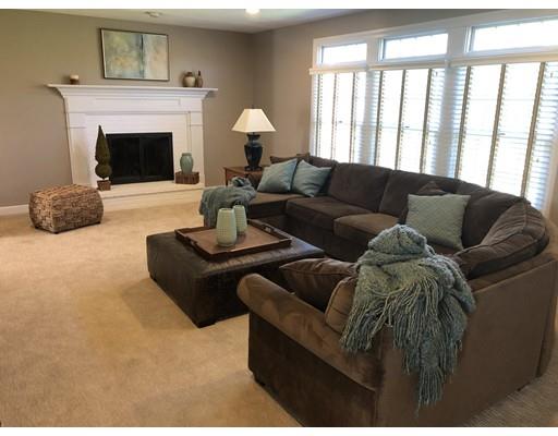 24 Birch Brush Road Shrewsbury, MA 01545 - Photo 2 of 27 a living room with furniture and a fireplace