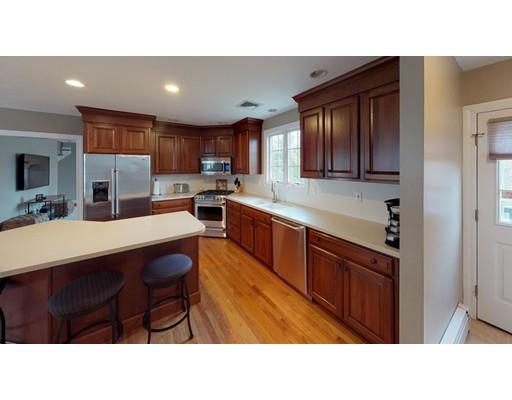 24 Birch Brush Road Shrewsbury, MA 01545 - Photo 7 of 27 a kitchen with stainless steel appliances kitchen island granite countertop a sink refrigerator and cabinets
