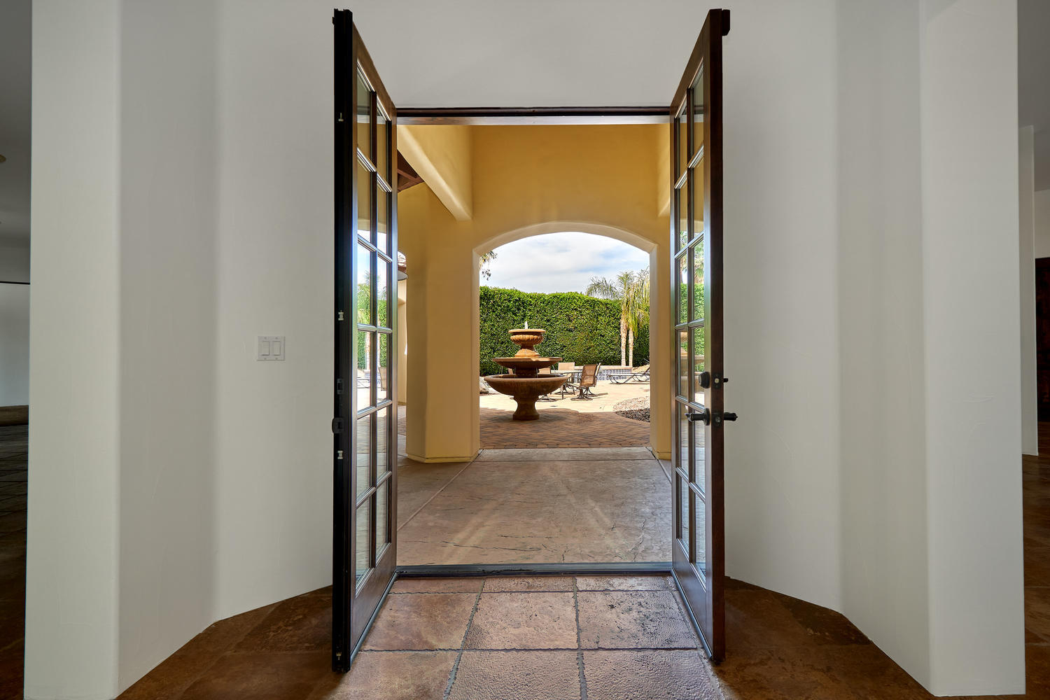 695 West Racquet Club Road Palm Springs, CA 92262 - Photo 21 of 50 a view of a door and chair