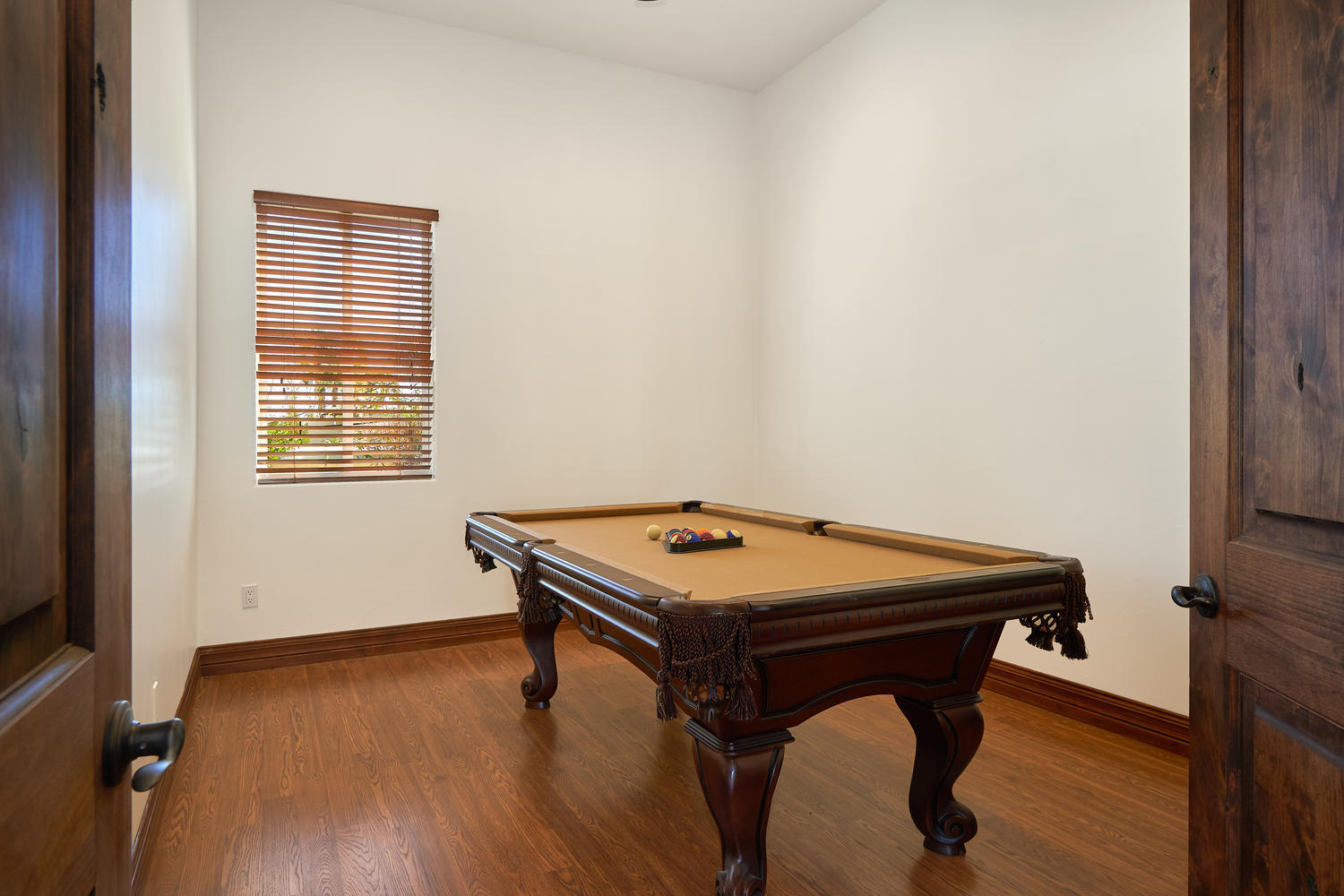 695 West Racquet Club Road Palm Springs, CA 92262 - Photo 22 of 50 a room with a table and wooden floor