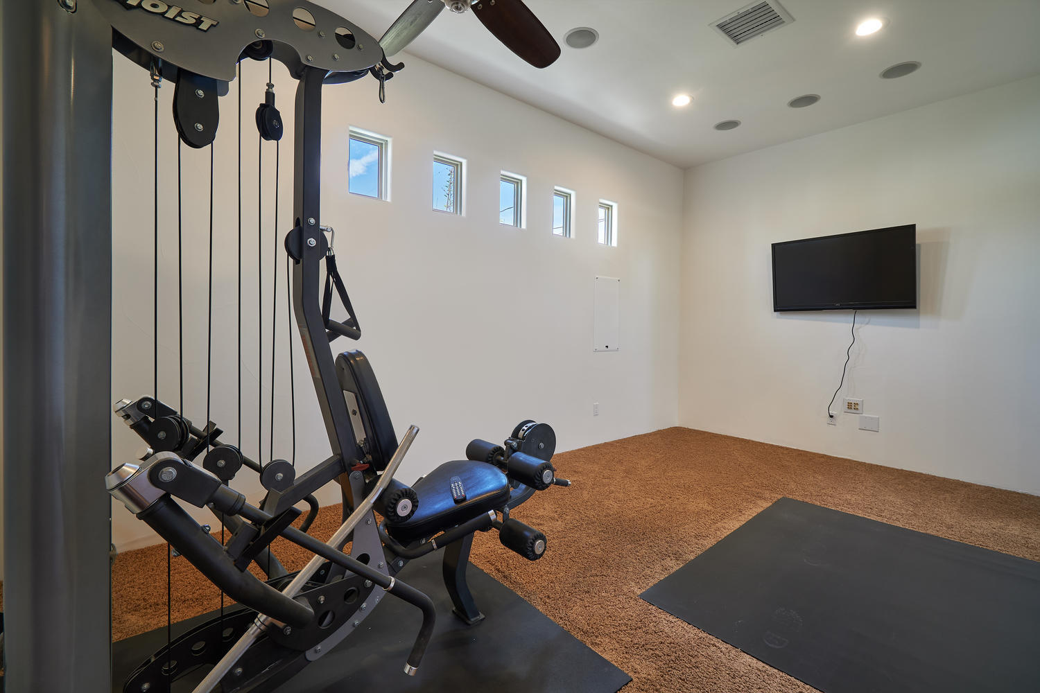 695 West Racquet Club Road Palm Springs, CA 92262 - Photo 23 of 50 a view of a livingroom with furniture and a flat screen tv