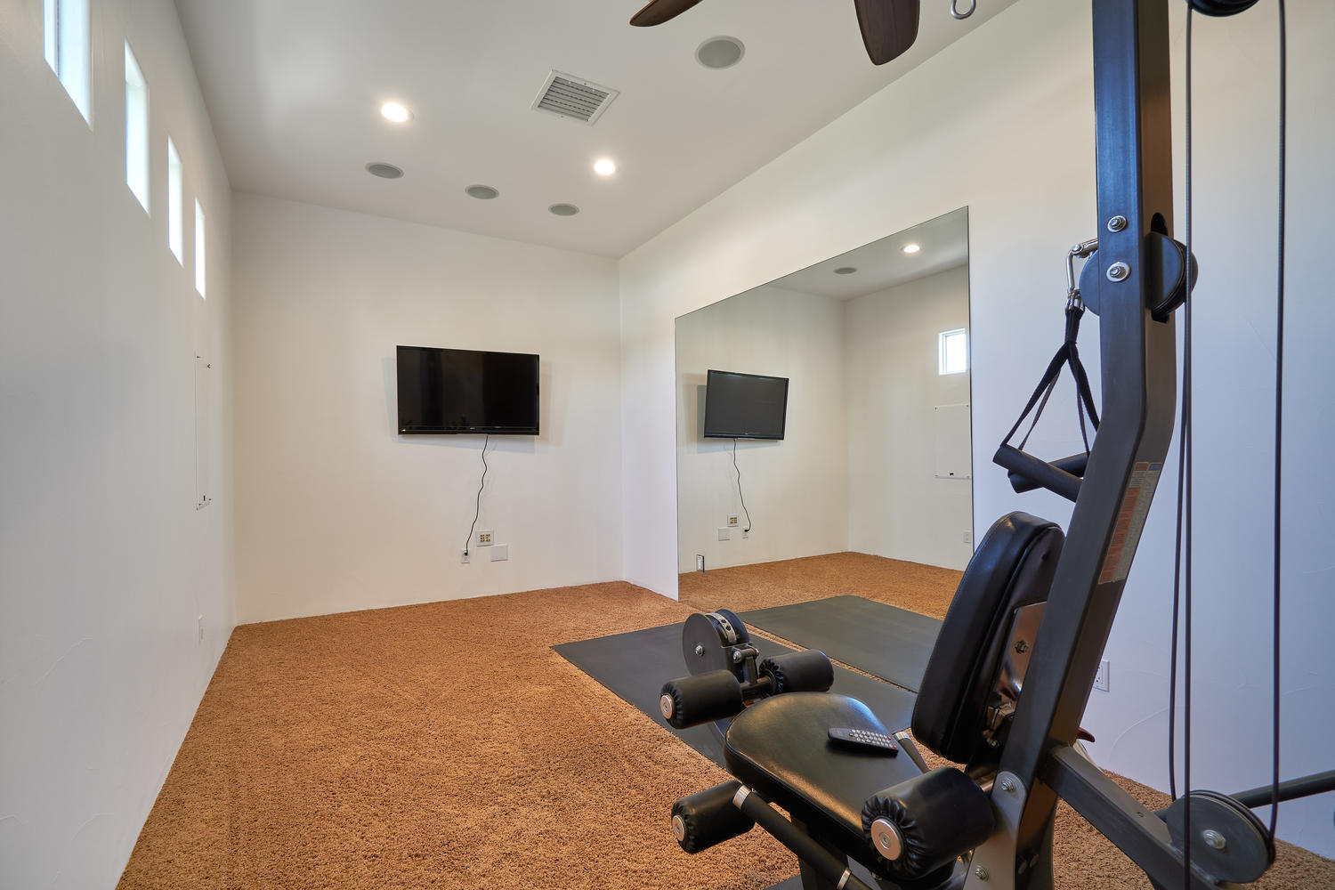 695 West Racquet Club Road Palm Springs, CA 92262 - Photo 24 of 50 a living room with furniture and a flat screen tv