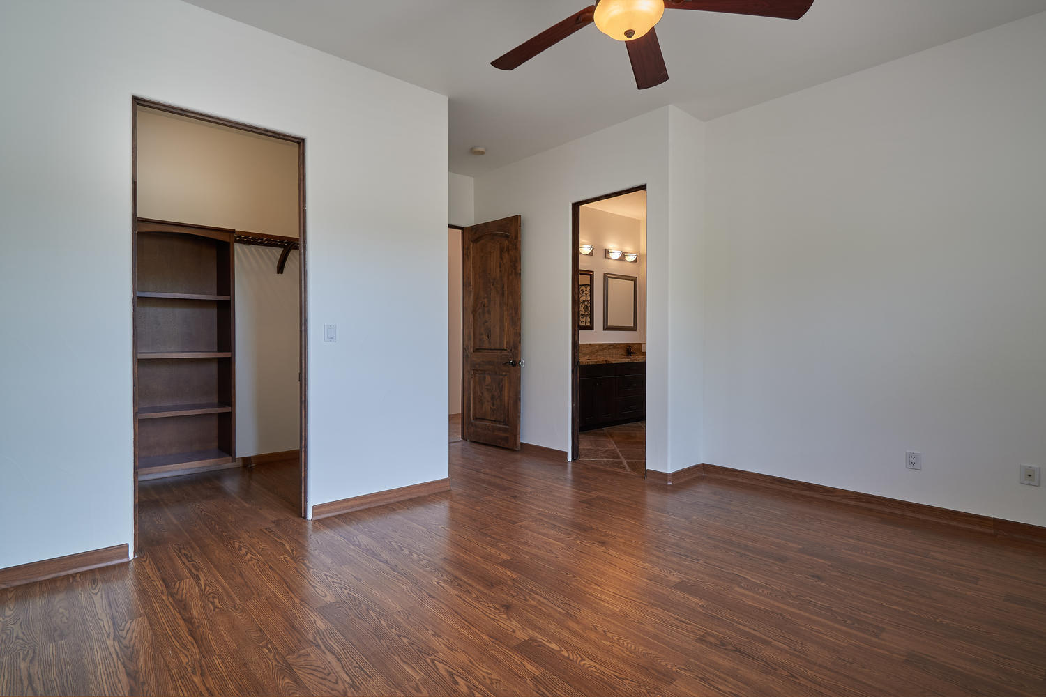 695 West Racquet Club Road Palm Springs, CA 92262 - Photo 36 of 50 an empty room with wooden floor closet and windows
