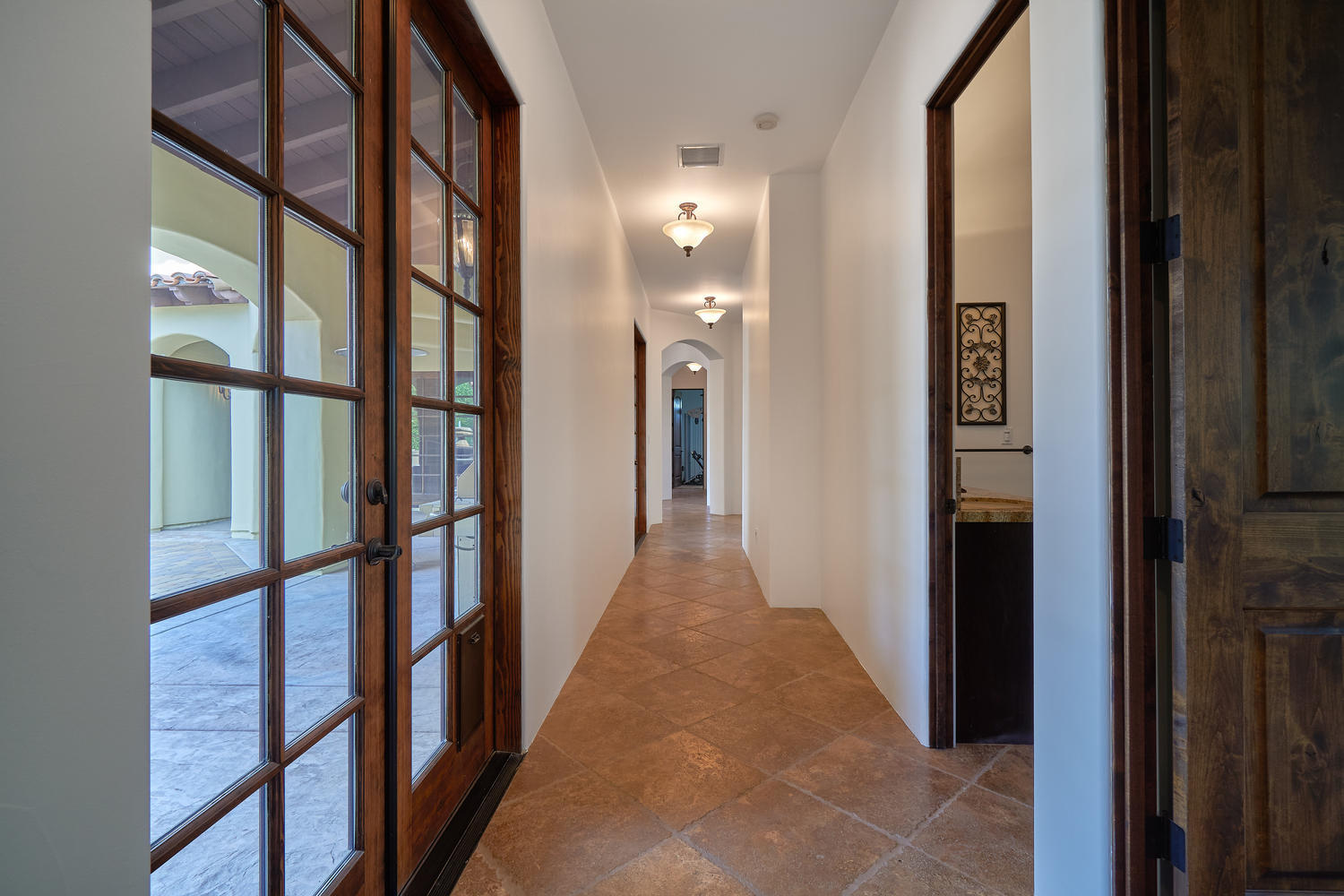 695 West Racquet Club Road Palm Springs, CA 92262 - Photo 39 of 50 a view of a hallway with wooden floor and staircase