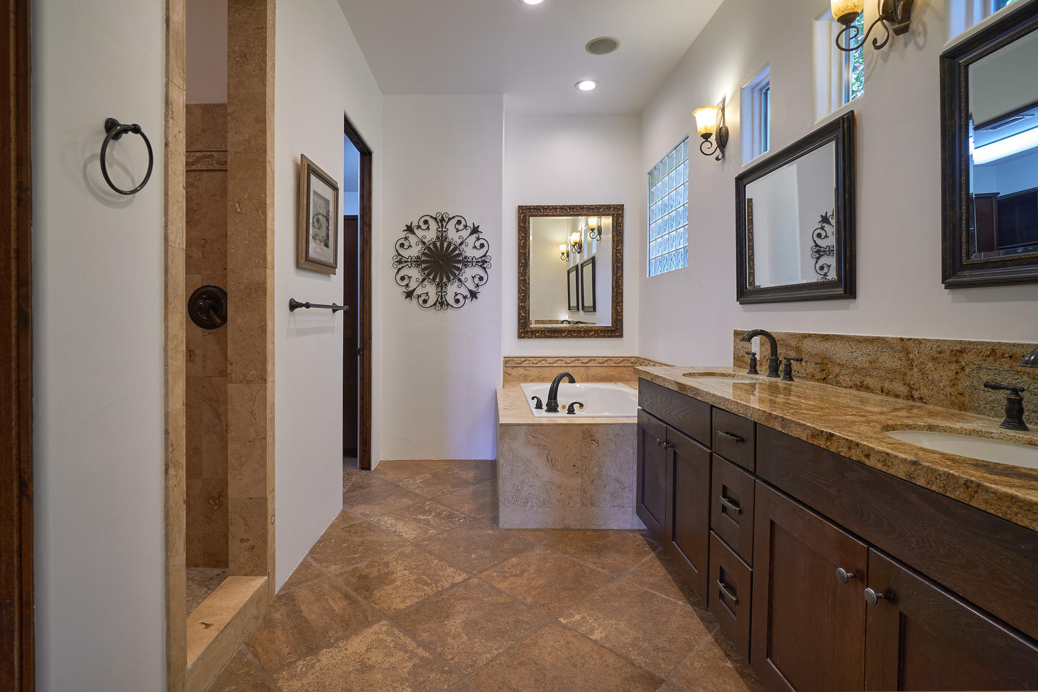 695 West Racquet Club Road Palm Springs, CA 92262 - Photo 43 of 50 a spacious bathroom with a granite countertop toilet sink and mirror