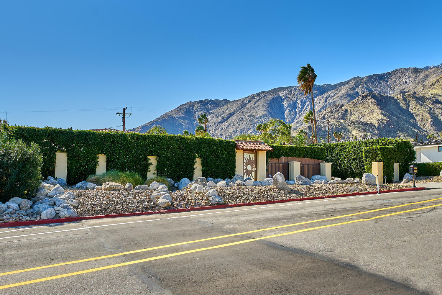 695 West Racquet Club Road Palm Springs, CA 92262 - Photo 50 of 50 a view of a house with a yard and potted plants