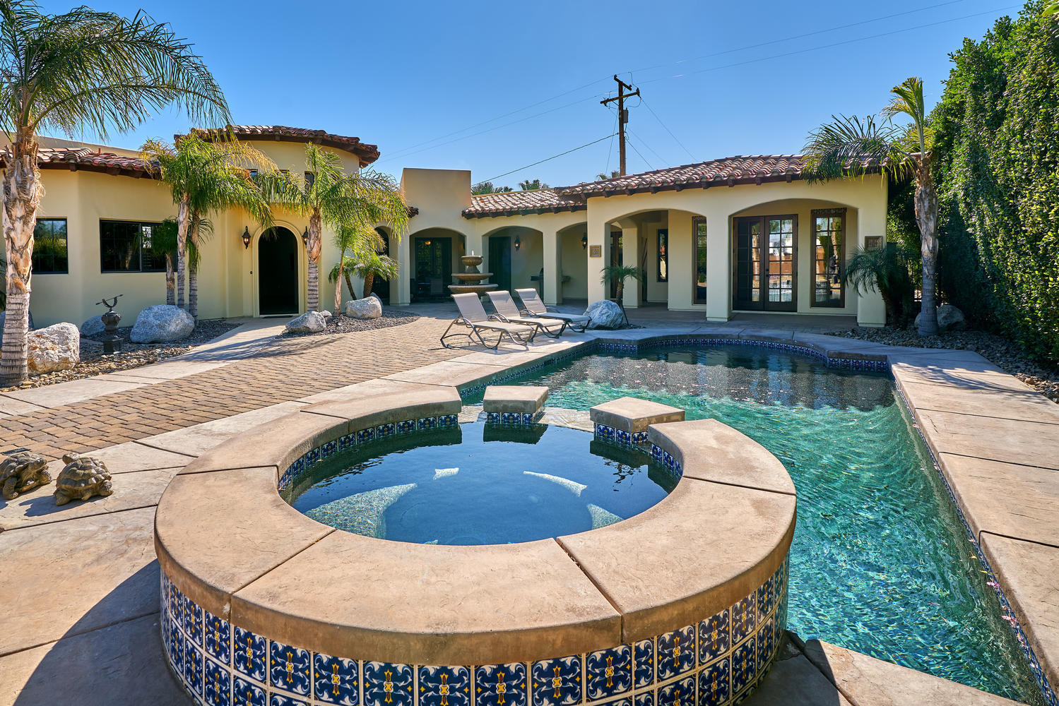 695 West Racquet Club Road Palm Springs, CA 92262 - Photo 7 of 50 a view of a house with swimming pool and sitting area