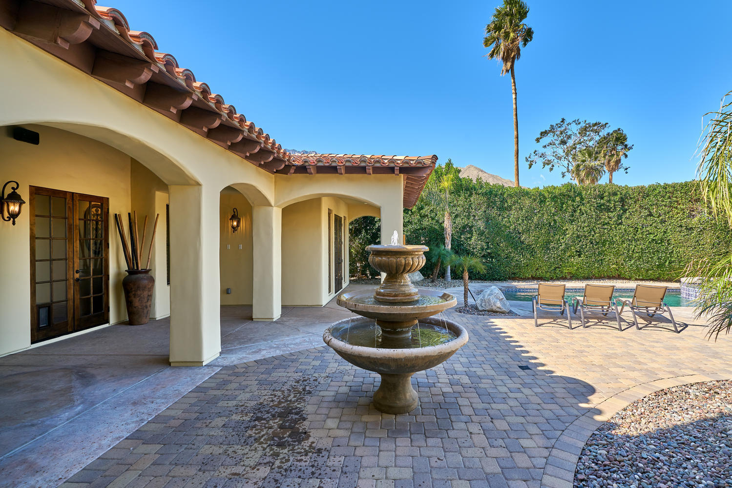 695 West Racquet Club Road Palm Springs, CA 92262 - Photo 8 of 50 a front view of a house with fountain