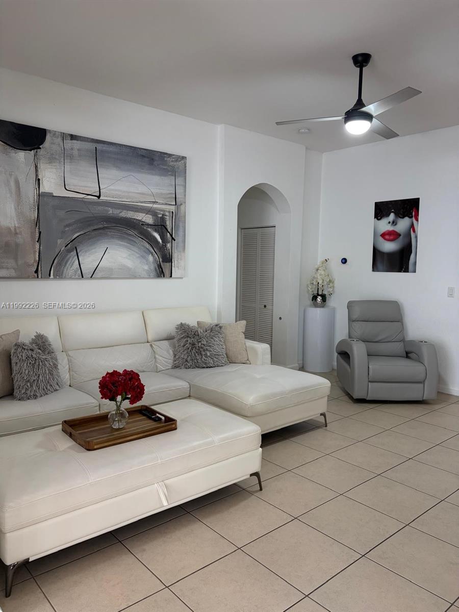 24982 Southwest 118th Court Homestead, FL 33032 - Photo 13 of 51 a living room with furniture and a lamp
