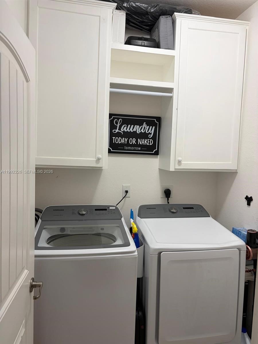 24982 Southwest 118th Court Homestead, FL 33032 - Photo 15 of 51 a utility room with dryer and washer