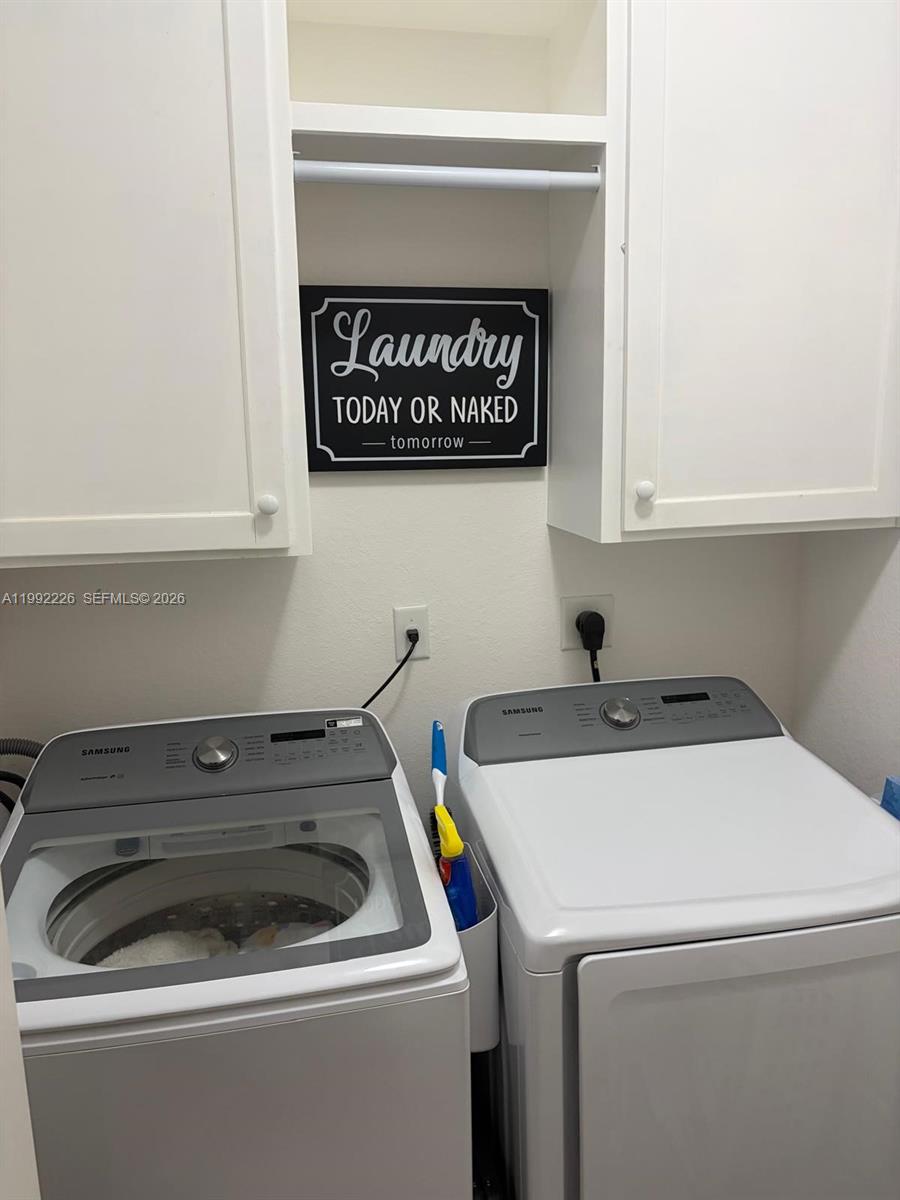 24982 Southwest 118th Court Homestead, FL 33032 - Photo 17 of 51 a utility room with dryer and washer