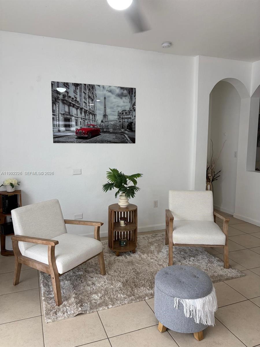 24982 Southwest 118th Court Homestead, FL 33032 - Photo 18 of 51 a living room with furniture and a potted plant