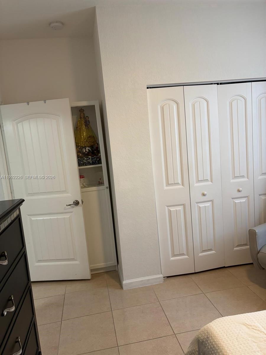 24982 Southwest 118th Court Homestead, FL 33032 - Photo 19 of 51 a view of a storage and utility room with stairs