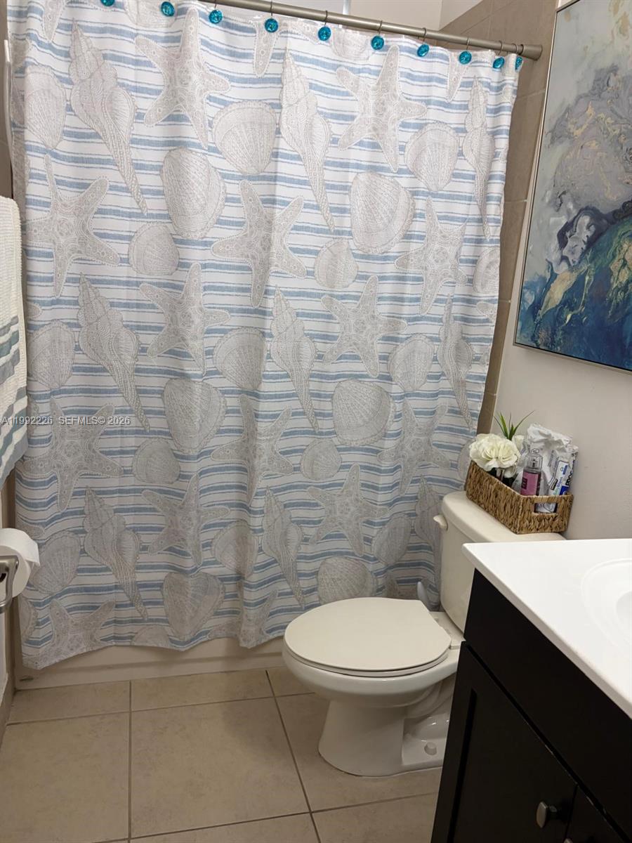 24982 Southwest 118th Court Homestead, FL 33032 - Photo 23 of 51 a bathroom with a toilet and a sink