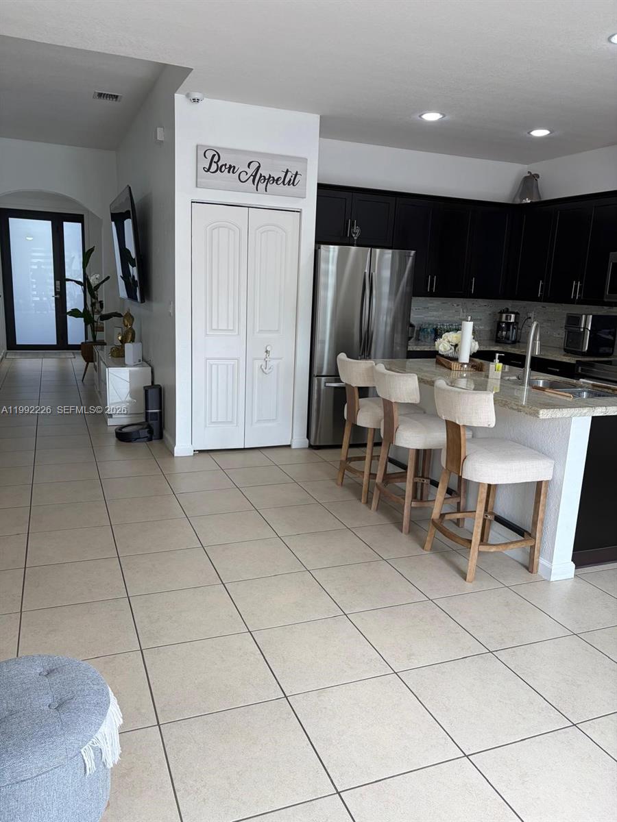 24982 Southwest 118th Court Homestead, FL 33032 - Photo 29 of 51 a view of kitchen with furniture and outdoor kitchen