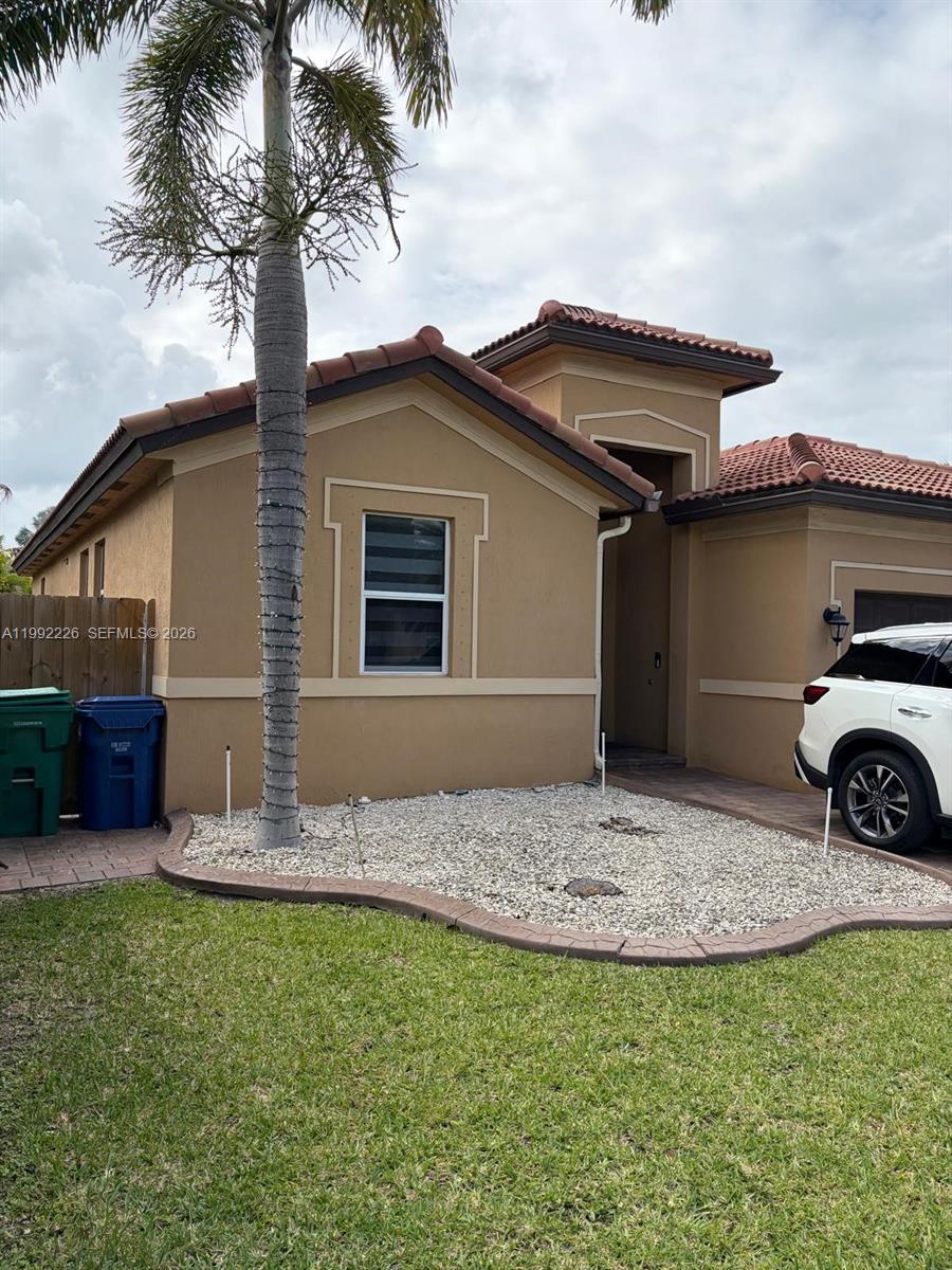24982 Southwest 118th Court Homestead, FL 33032 - Photo 39 of 51 a front view of a house with garden