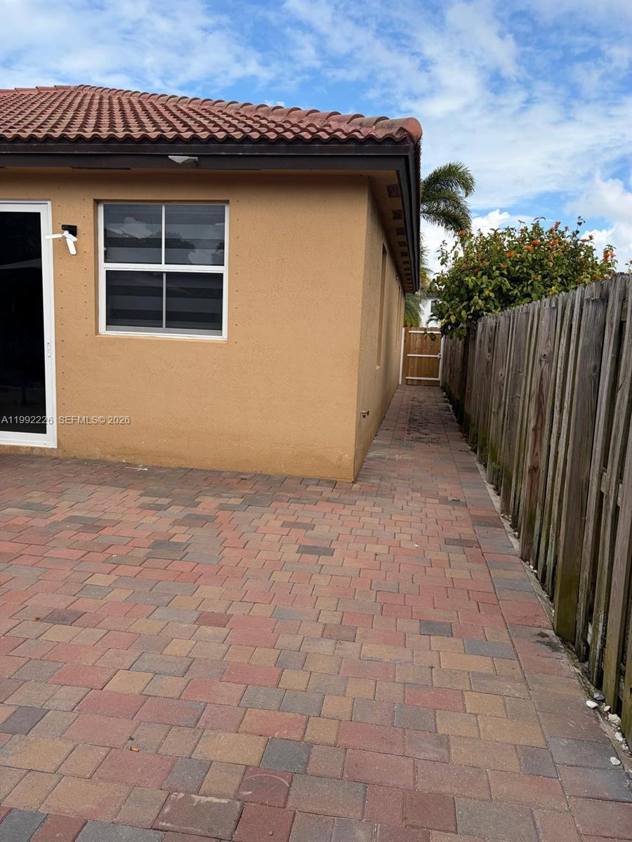 24982 Southwest 118th Court Homestead, FL 33032 - Photo 44 of 51 a view of a house with wooden fence