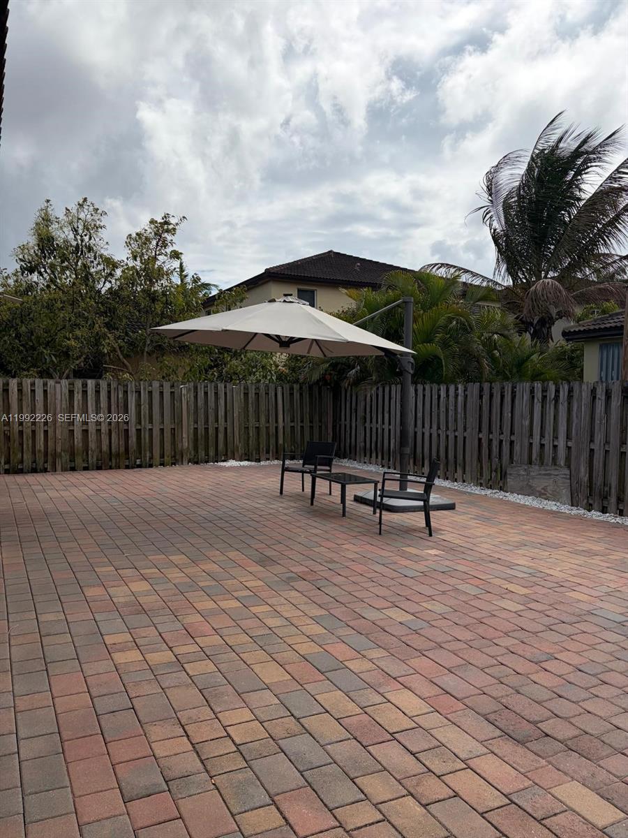 24982 Southwest 118th Court Homestead, FL 33032 - Photo 46 of 51 a terrace with outdoor seating