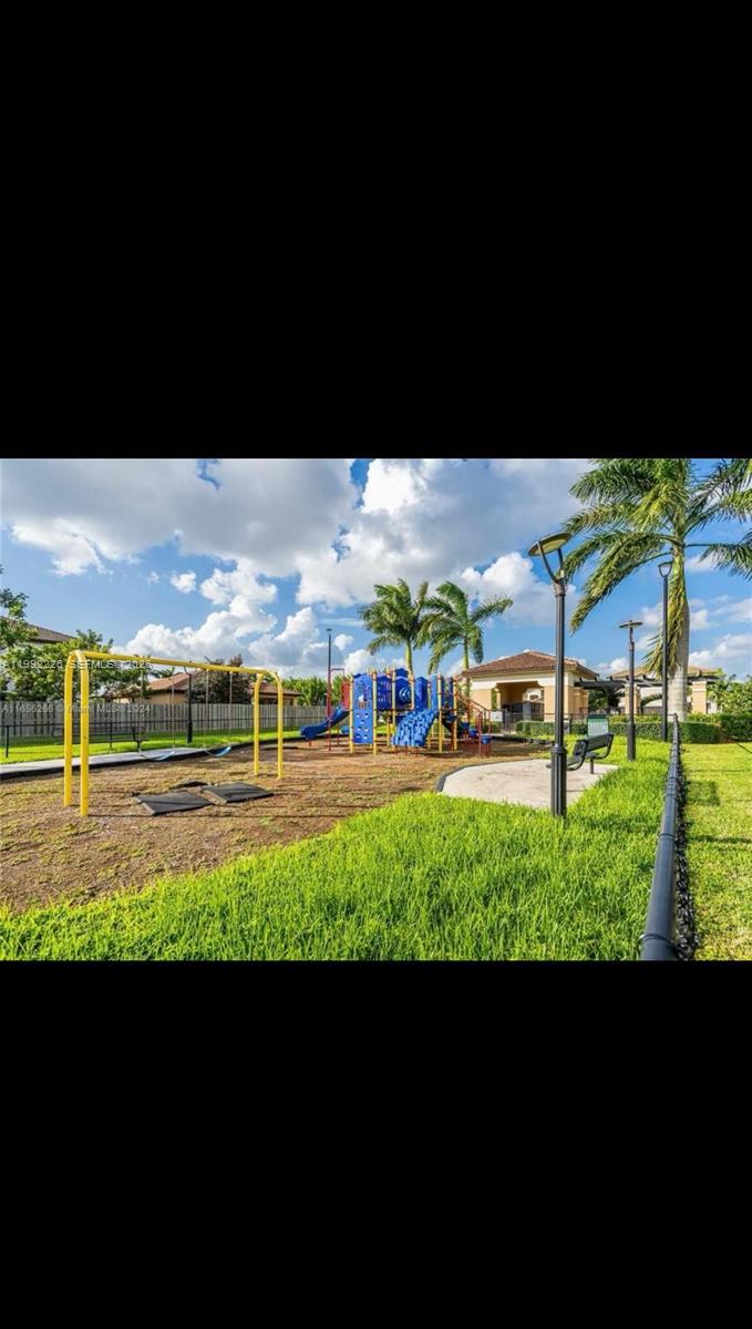 24982 Southwest 118th Court Homestead, FL 33032 - Photo 48 of 51 a view of an chairs and table in the back yard