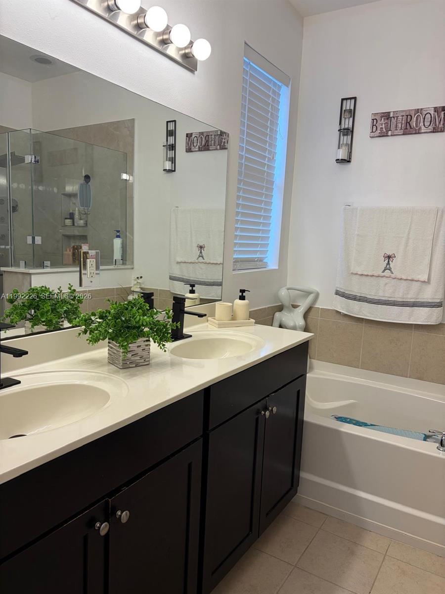 24982 Southwest 118th Court Homestead, FL 33032 - Photo 5 of 51 a bathroom with a sink and a bathtub