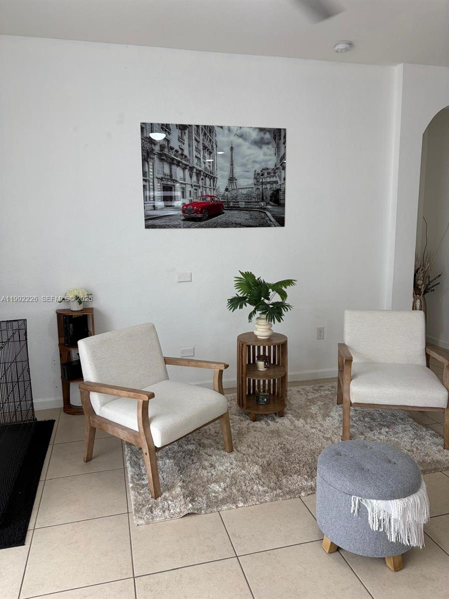 24982 Southwest 118th Court Homestead, FL 33032 - Photo 10 of 51 a living room with furniture and a potted plant