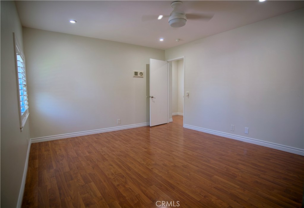 10 Raleigh Irvine, CA 92604 - Photo 13 of 30 an empty room with wooden floor and windows