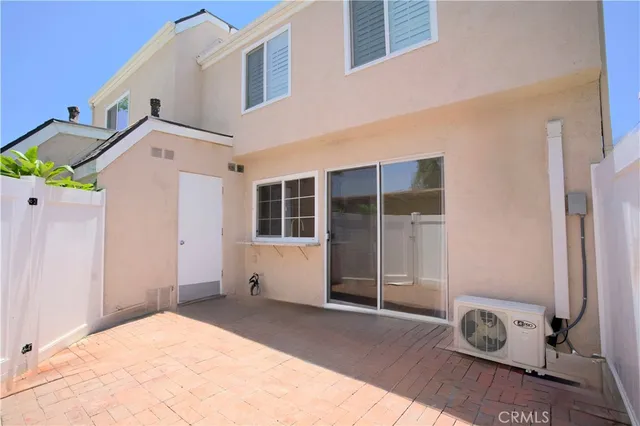 a plant that is sitting in front of a house