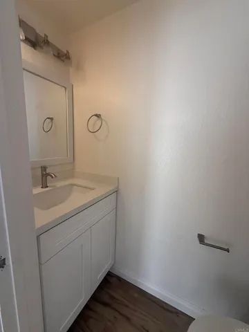 a bathroom with a sink toilet and vanity