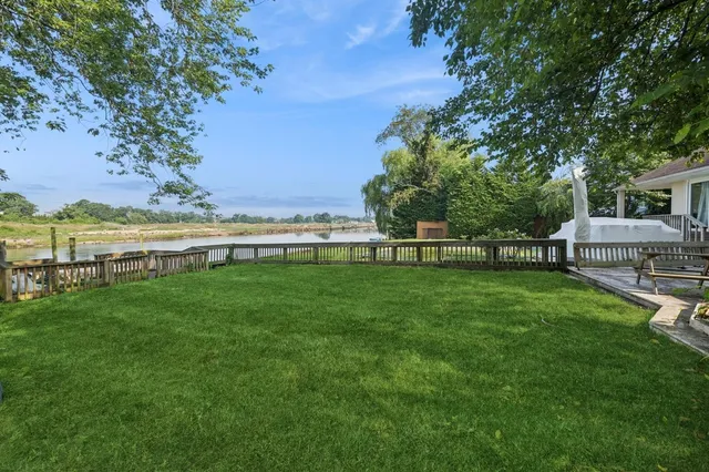 a view of a garden with an ocean