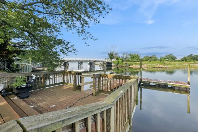 a view of a balcony with two chairs