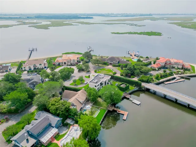 an aerial view of a house with a lake view