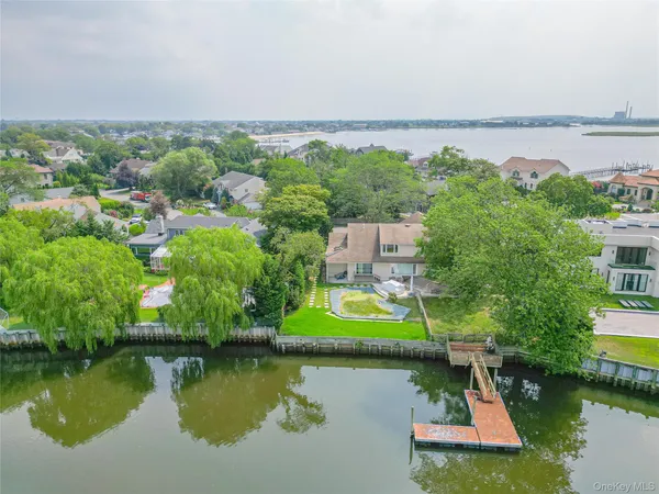 a view of a lake with a house in the background