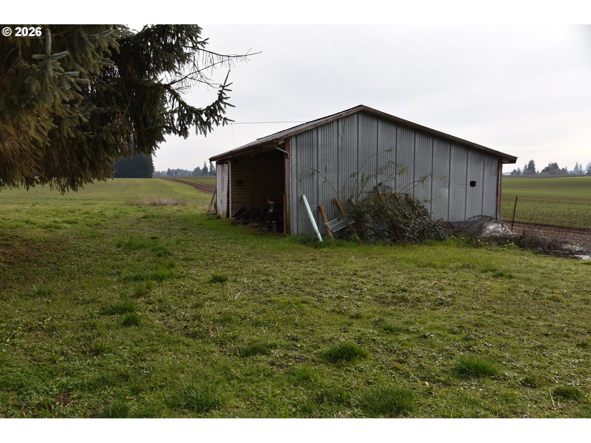 3678 Southwest Golf Course Road Cornelius, OR 97113 - Photo 14 of 14 a backyard of a house with lots of green space