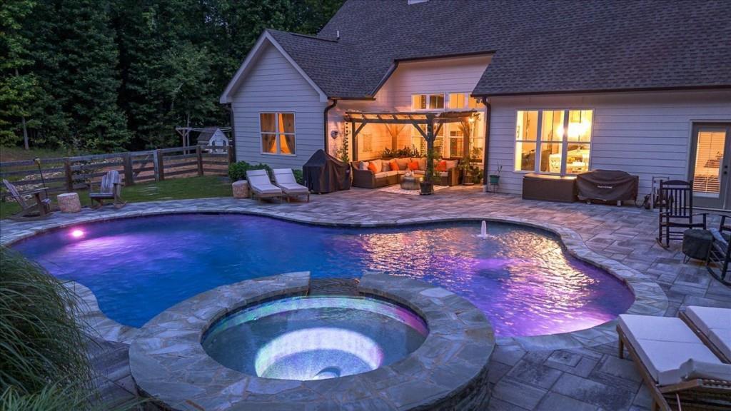 a view of swimming pool with outdoor seating
